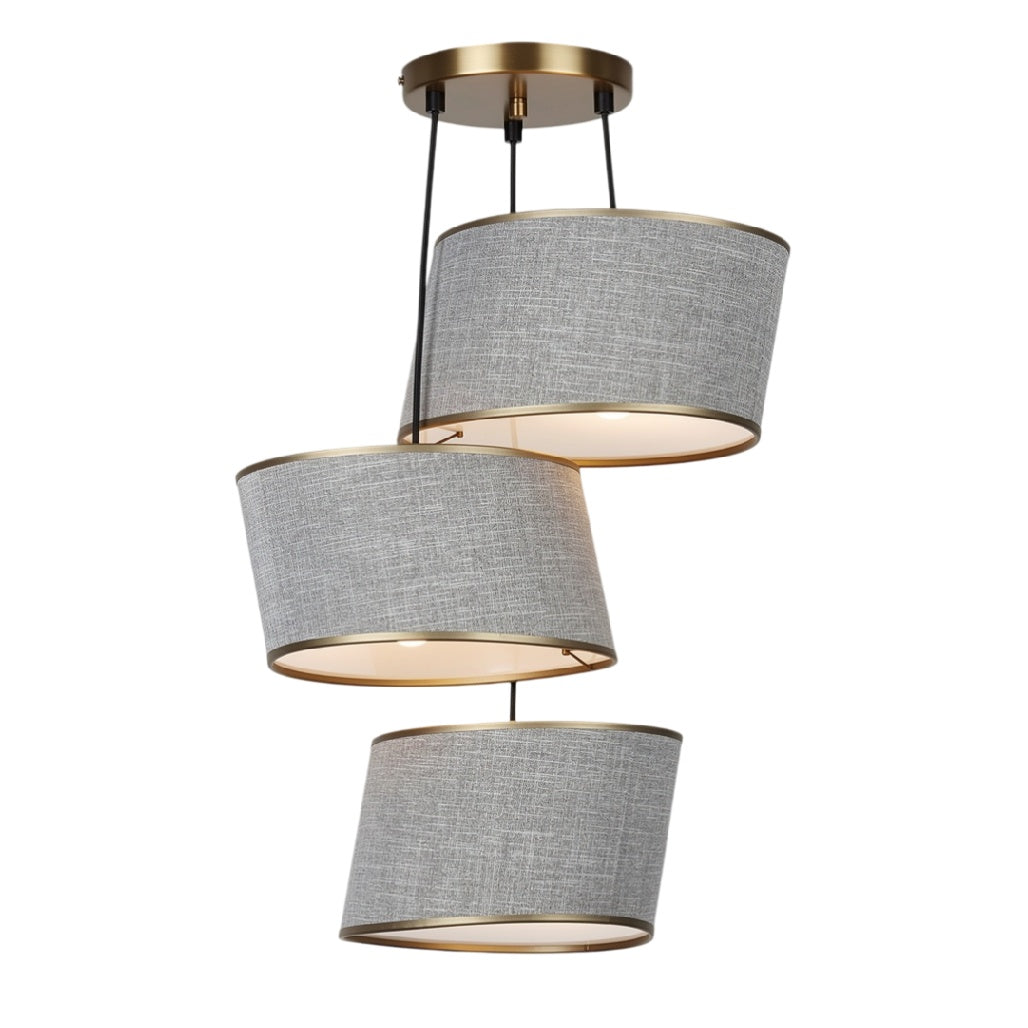 **Suspension moderne à trois abat-jours en textile gris avec accents dorés**